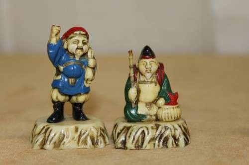 A WONDERFUL SET OF SEVEN "JAPANESE SEVEN LUCKY GODS" HAND PAINTED & NUMBERED BAKELITE FIGURINES