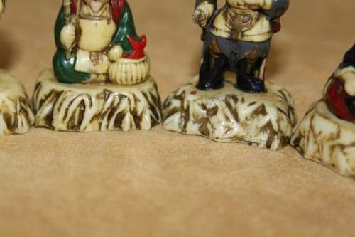 A WONDERFUL SET OF SEVEN "JAPANESE SEVEN LUCKY GODS" HAND PAINTED & NUMBERED BAKELITE FIGURINES