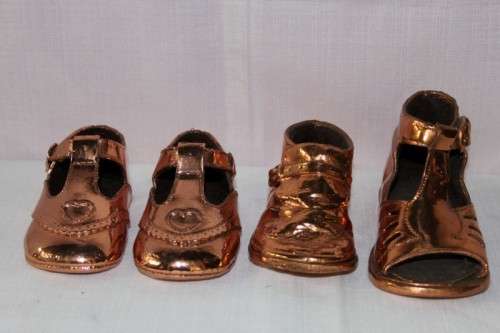 FOUR STUNNING "BOOTEE BRONZING" COPPER PLATED BABY SHOES IN FANTASTIC CONDITION bid/shoe