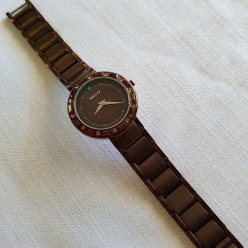 A STUNNING "DKNY" BRONZE-CUT LADIES WRIST WATCH WITH SMOKEY TOPAZ CRYSTALS IN FABULOUS CONDITION