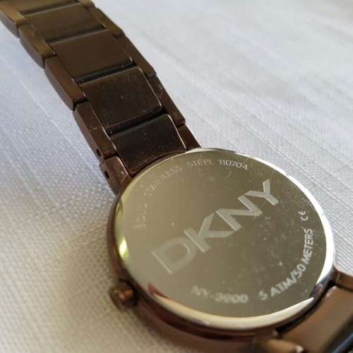 A STUNNING "DKNY" BRONZE-CUT LADIES WRIST WATCH WITH SMOKEY TOPAZ CRYSTALS IN FABULOUS CONDITION