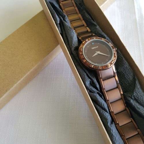 A STUNNING "DKNY" BRONZE-CUT LADIES WRIST WATCH WITH SMOKEY TOPAZ CRYSTALS IN FABULOUS CONDITION