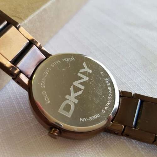 A STUNNING "DKNY" BRONZE-CUT LADIES WRIST WATCH WITH SMOKEY TOPAZ CRYSTALS IN FABULOUS CONDITION