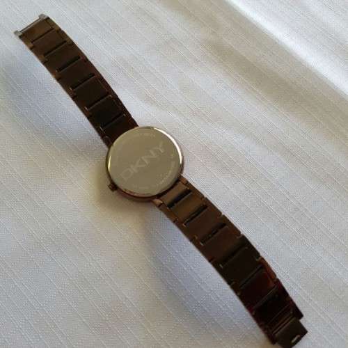 A STUNNING "DKNY" BRONZE-CUT LADIES WRIST WATCH WITH SMOKEY TOPAZ CRYSTALS IN FABULOUS CONDITION