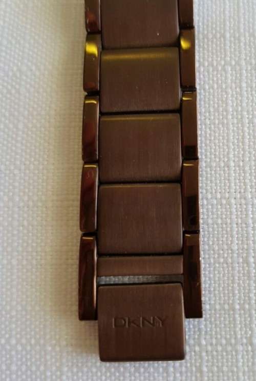 A STUNNING "DKNY" BRONZE-CUT LADIES WRIST WATCH WITH SMOKEY TOPAZ CRYSTALS IN FABULOUS CONDITION