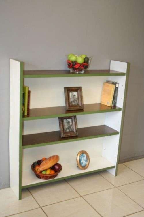 A GORGEOUS WHITE AND BROWN BOOK CASE WITH GREEN FACADES - PERFECT FOR A STUDY OR OFFICE