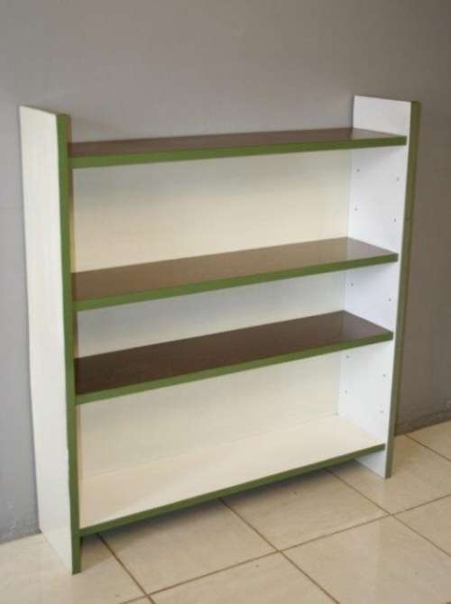 A GORGEOUS WHITE AND BROWN BOOK CASE WITH GREEN FACADES - PERFECT FOR A STUDY OR OFFICE