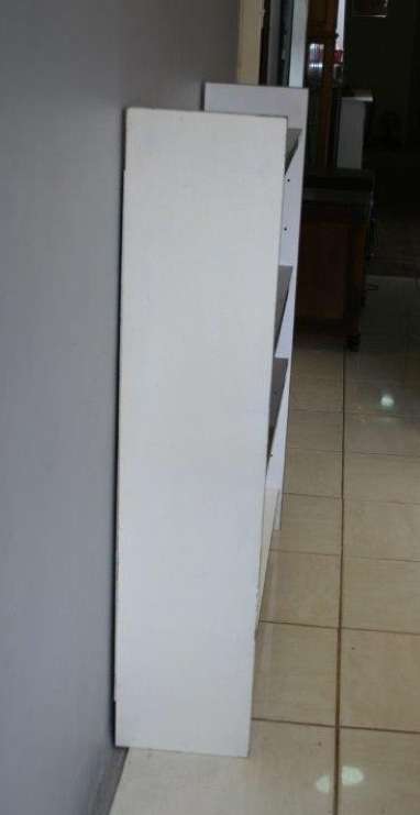 A GORGEOUS WHITE AND BROWN BOOK CASE WITH GREEN FACADES - PERFECT FOR A STUDY OR OFFICE