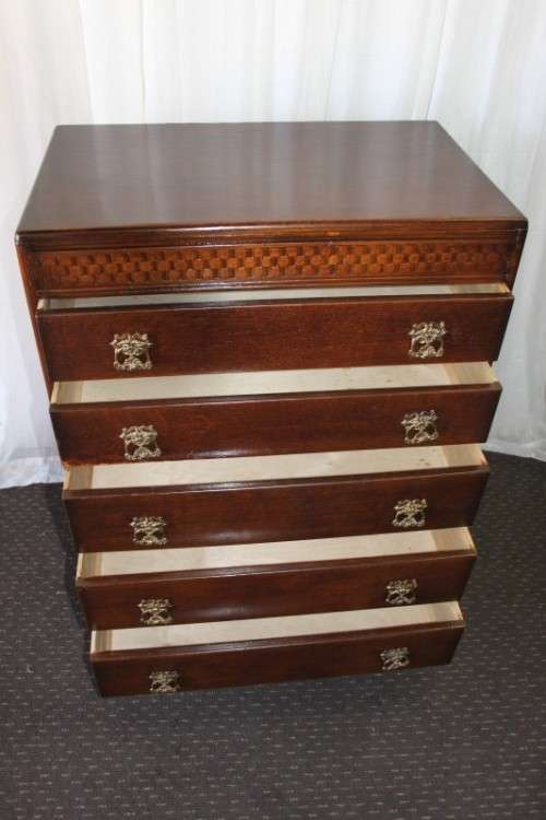 A beautiful Solidly built 5-drawer chest of drawers with stunning styling & ornate handles