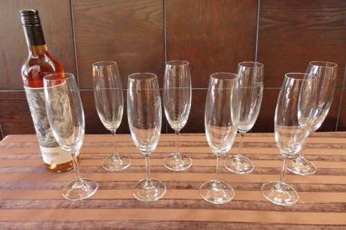 AN AWESOME COLLECTION OF EIGHT TALL FLUTED CHAMPAGNE GLASSES IN GREAT CONDITION
