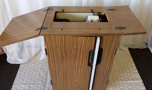 AN AMAZING VINTAGE (WORKING) "FRICK" SEWING MACHINE IN ITS ORIGINAL WOODEN CABINET