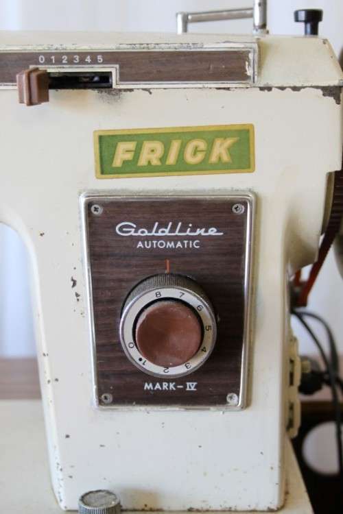 AN AMAZING VINTAGE (WORKING) "FRICK" SEWING MACHINE IN ITS ORIGINAL WOODEN CABINET