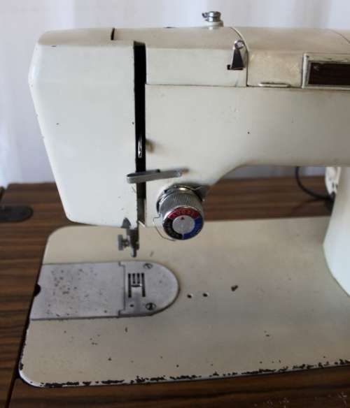 AN AMAZING VINTAGE (WORKING) "FRICK" SEWING MACHINE IN ITS ORIGINAL WOODEN CABINET