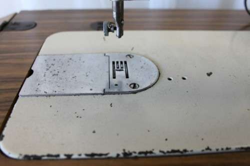 AN AMAZING VINTAGE (WORKING) "FRICK" SEWING MACHINE IN ITS ORIGINAL WOODEN CABINET