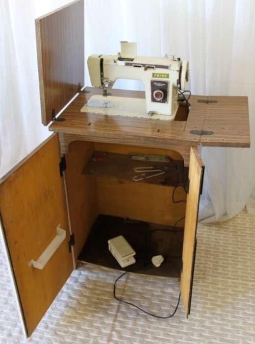 AN AMAZING VINTAGE (WORKING) "FRICK" SEWING MACHINE IN ITS ORIGINAL WOODEN CABINET