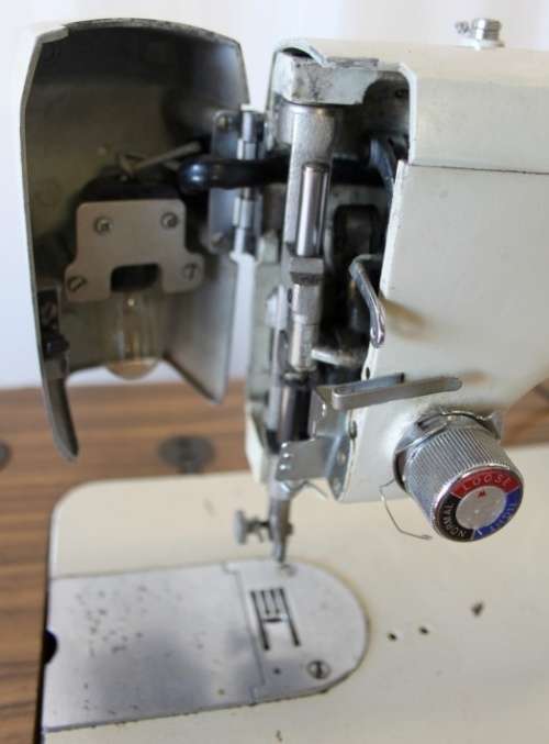 AN AMAZING VINTAGE (WORKING) "FRICK" SEWING MACHINE IN ITS ORIGINAL WOODEN CABINET