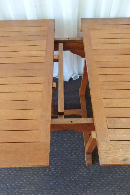 A STUNNING 6 TO 8 SEATER OUTDOOR EXTENDABLE DINING TABLE WITH A "HIDDEN" EXTENSION COMPARTMENT