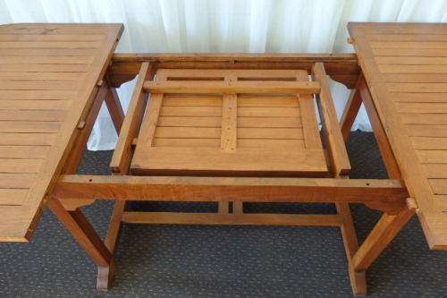 A STUNNING 6 TO 8 SEATER OUTDOOR EXTENDABLE DINING TABLE WITH A "HIDDEN" EXTENSION COMPARTMENT