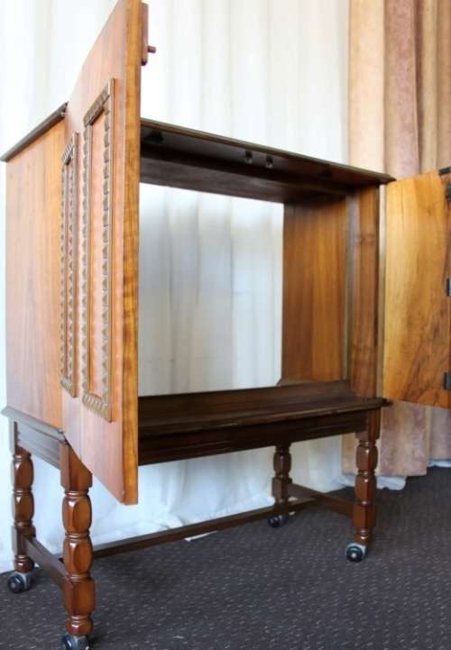 AN AMAZING RETRO (c1970's) WOODEN CABINET ON ITS ORIGINAL CASTORS WITH AWESOME RELIEF DETAILING