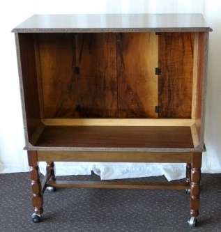 AN AMAZING RETRO (c1970's) WOODEN CABINET ON ITS ORIGINAL CASTORS WITH AWESOME RELIEF DETAILING
