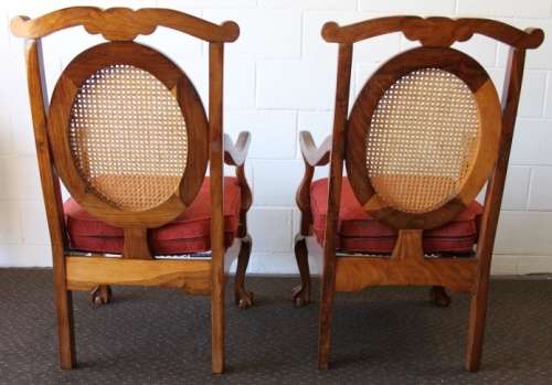 Two beautiful solid Stink Wood Ball & Claw occasional arm chairs with wicker backrests!!! bid/chair