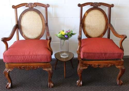 Two beautiful solid Stink Wood Ball & Claw occasional arm chairs with wicker backrests!!! bid/chair