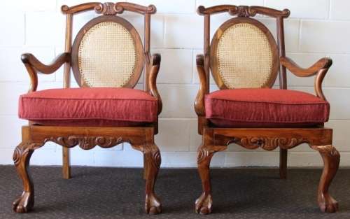 Two beautiful solid Stink Wood Ball & Claw occasional arm chairs with wicker backrests!!! bid/chair