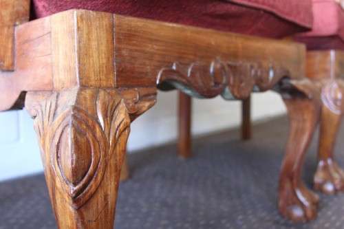 Two beautiful solid Stink Wood Ball & Claw occasional arm chairs with wicker backrests!!! bid/chair