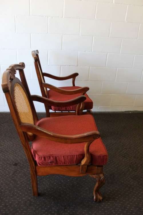Two beautiful solid Stink Wood Ball & Claw occasional arm chairs with wicker backrests!!! bid/chair