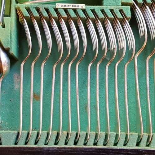 A spectacular antique Hallmarked sterling silver Walker & Hall boxed 12 place setting cutlery set