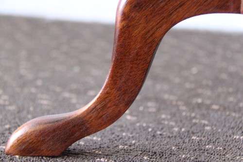 A stunning Victorian antique mahogany occasional table w/ a leather clad top and scalloped rim