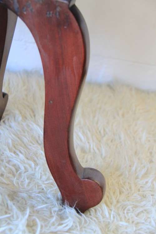 A spectacular solid mahogany "captain's swivel chair" with period British green upholstery