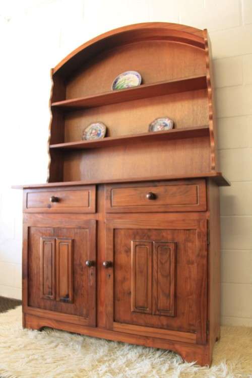 A stunning teak buffet server w/ two display shelves and ample storage space in remarkable condition