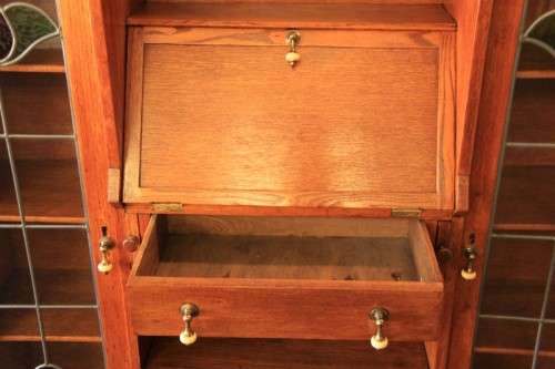 An awesome solid oak writing desk/ cabinet with incredible stained glass panels and ornate handles