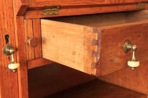 An awesome solid oak writing desk/ cabinet with incredible stained glass panels and ornate handles