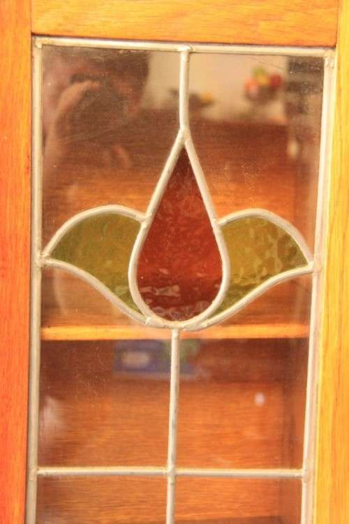 An awesome solid oak writing desk/ cabinet with incredible stained glass panels and ornate handles