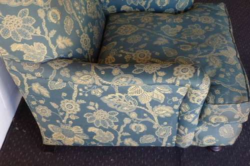 A beautiful "oversized" comfortable vintage arm chair on its original castors in fabulous condition