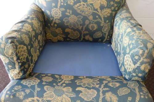 A beautiful "oversized" comfortable vintage arm chair on its original castors in fabulous condition