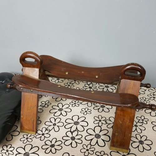 A wonderful vintage Moroccan "Camel Saddle" ottoman stool with stunning brass inlay detailing