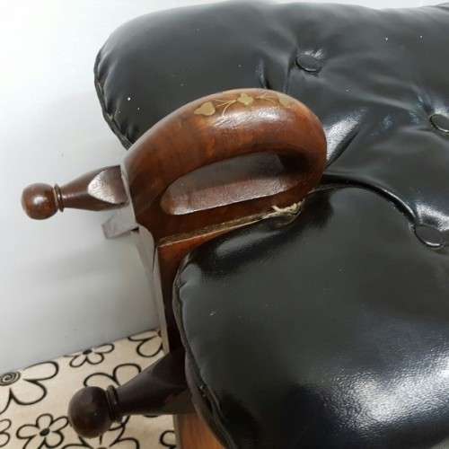 A wonderful vintage Moroccan "Camel Saddle" ottoman stool with stunning brass inlay detailing