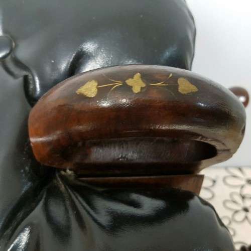 A wonderful vintage Moroccan "Camel Saddle" ottoman stool with stunning brass inlay detailing