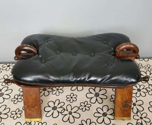 A wonderful vintage Moroccan "Camel Saddle" ottoman stool with stunning brass inlay detailing