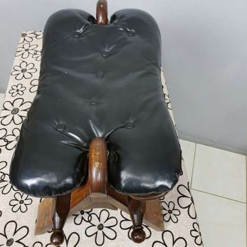 A wonderful vintage Moroccan "Camel Saddle" ottoman stool with stunning brass inlay detailing
