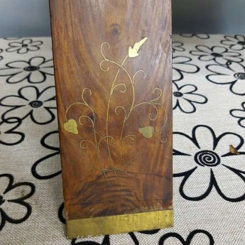 A wonderful vintage Moroccan "Camel Saddle" ottoman stool with stunning brass inlay detailing