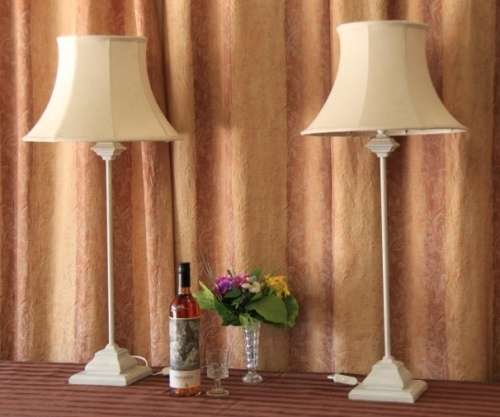 Two beautiful and elegant "tall" occasional table/ bedside lamps with white shades bid/lamp