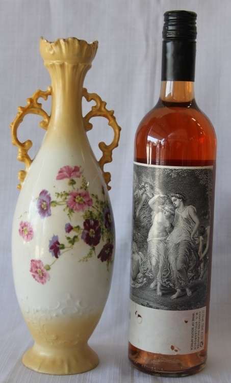 A gorgeous tall German-porcelain vase with scroll handles, flared rim and transfer print flowers