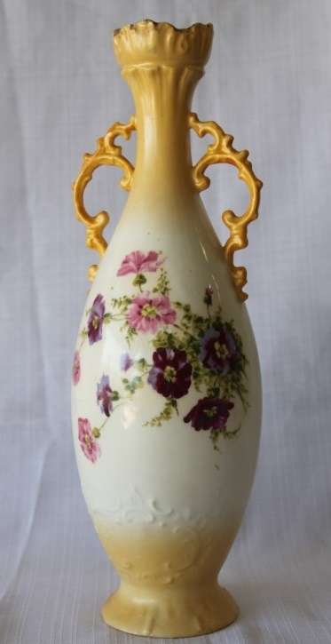 A gorgeous tall German-porcelain vase with scroll handles, flared rim and transfer print flowers