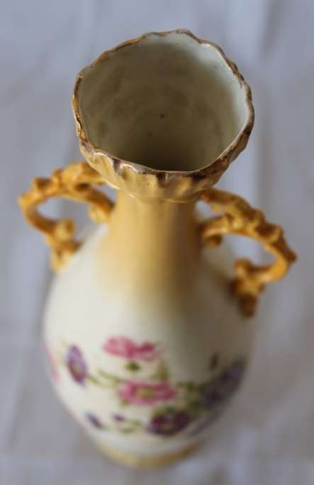 A gorgeous tall German-porcelain vase with scroll handles, flared rim and transfer print flowers