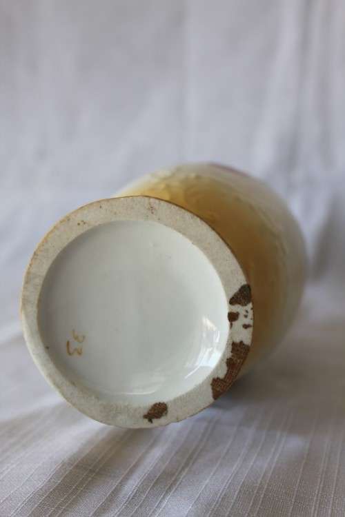A gorgeous tall German-porcelain vase with scroll handles, flared rim and transfer print flowers