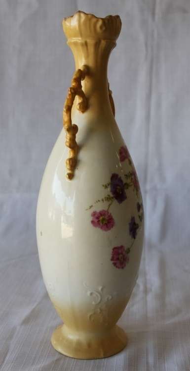 A gorgeous tall German-porcelain vase with scroll handles, flared rim and transfer print flowers